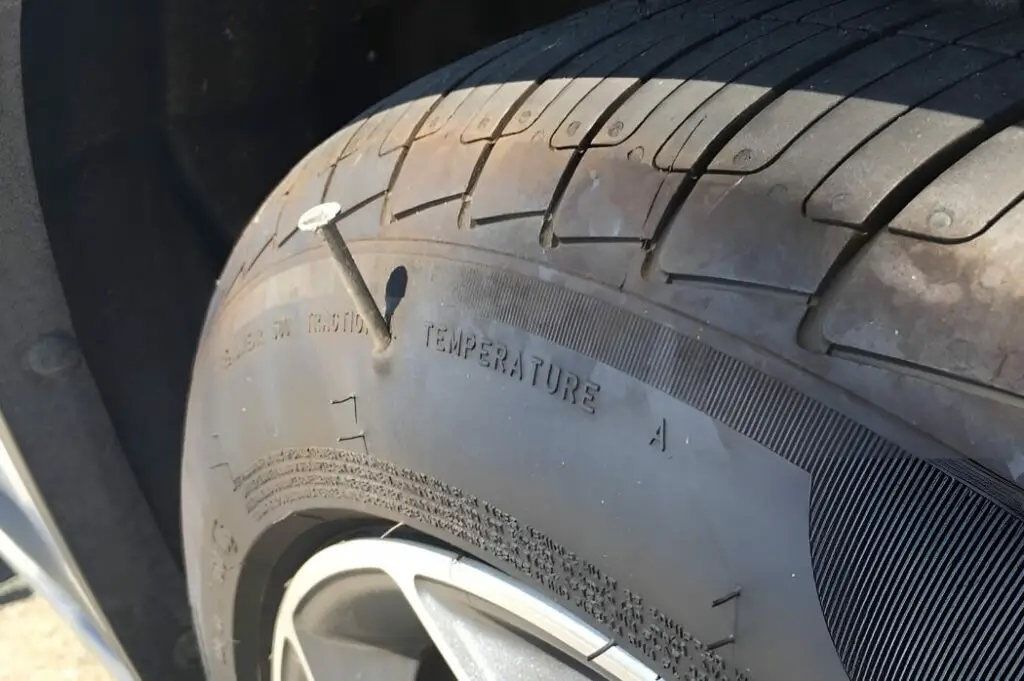 can you drive with a nail in your tire
